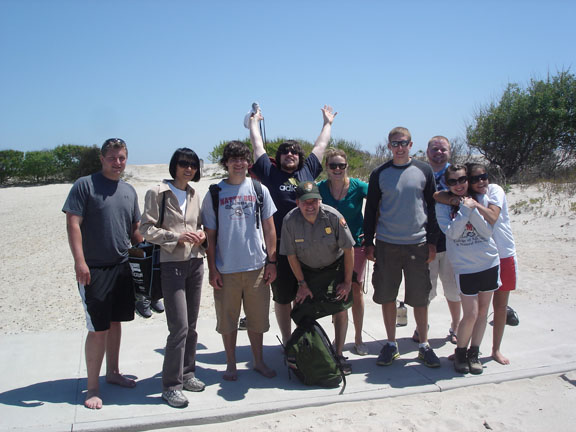 A group of people posing for a photo

Description automatically generated