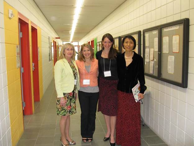 A group of women posing for a photo

Description automatically generated with medium confidence