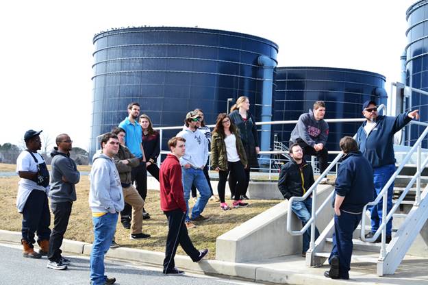 A group of people standing on stairs

Description automatically generated with low confidence